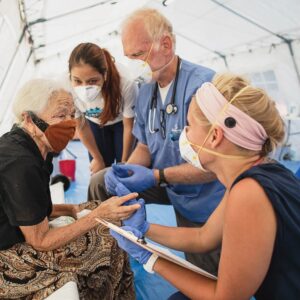 medical team helping injured hurricane victim